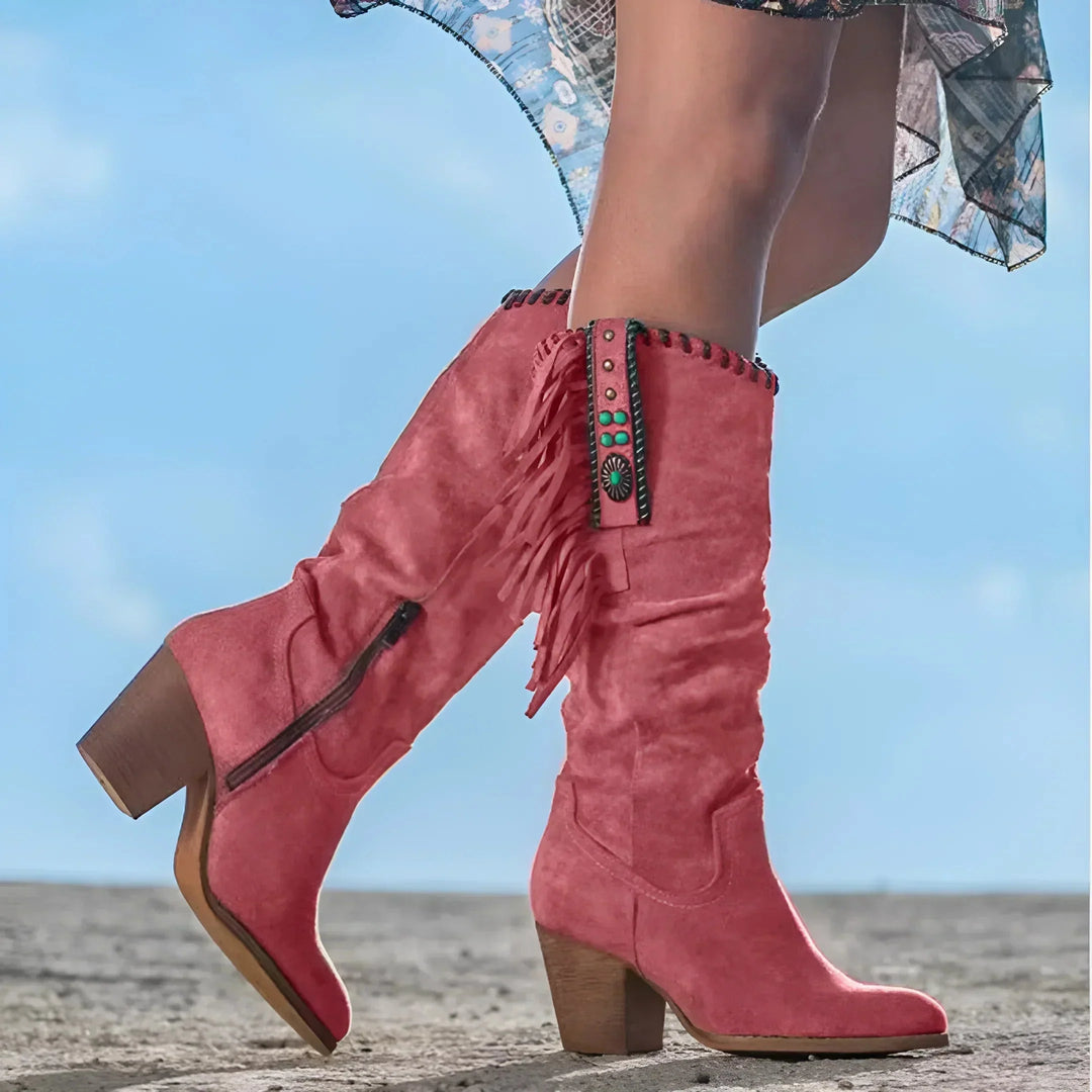 Back view of tall fringe cowgirl boots showcasing sturdy block heel and leather texture