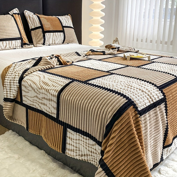 Brown and white checkered plush fleece blanket styling a cozy bedroom