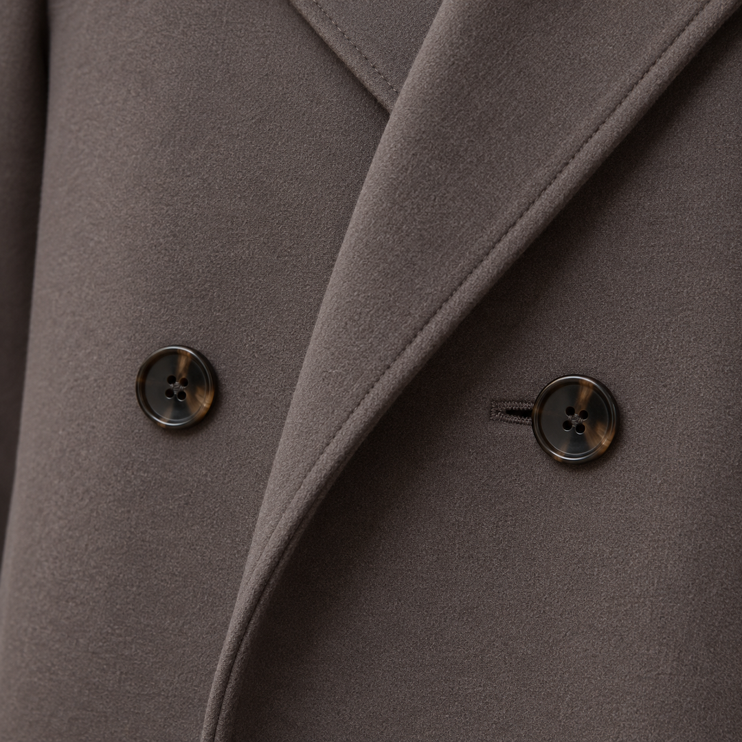 Close-up of lapel collar and buttons on brown womens double breasted coat