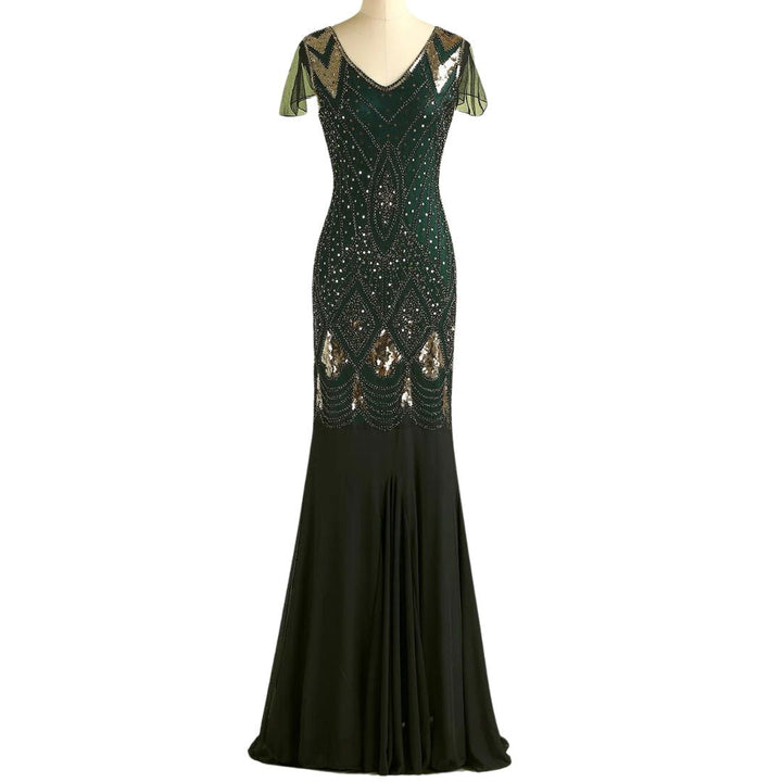 Mannequin display of a dark green and gold sequined long flapper dress