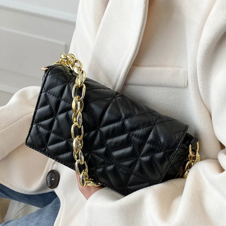 Close-up of black jacquard weave texture on women's handbag