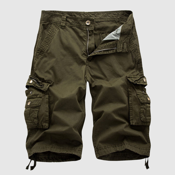 Lifestyle flat lay of men's cargo shorts with summer accessories