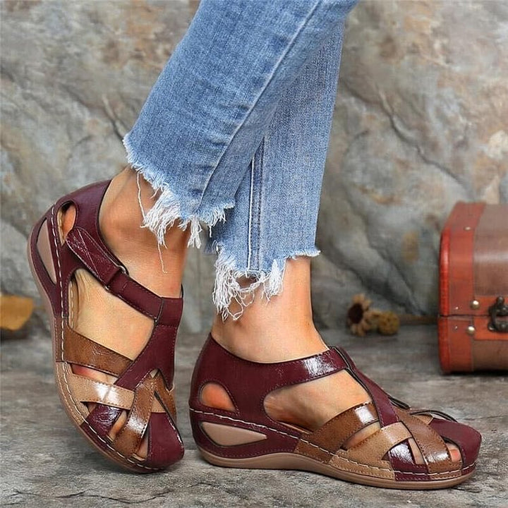 Woman wearing red woven platform sandals outdoors