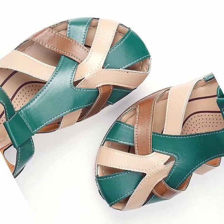 Side profile view of women's woven T-strap platform sandals showing wedge heel