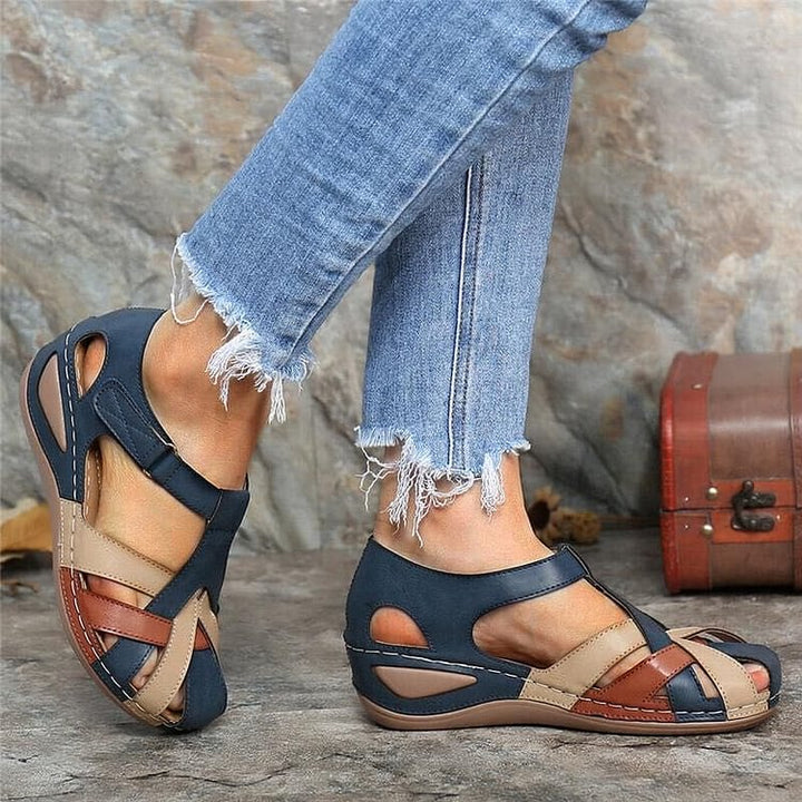 Top-down view of comfortable footbed and T-strap design on women's wedge sandals