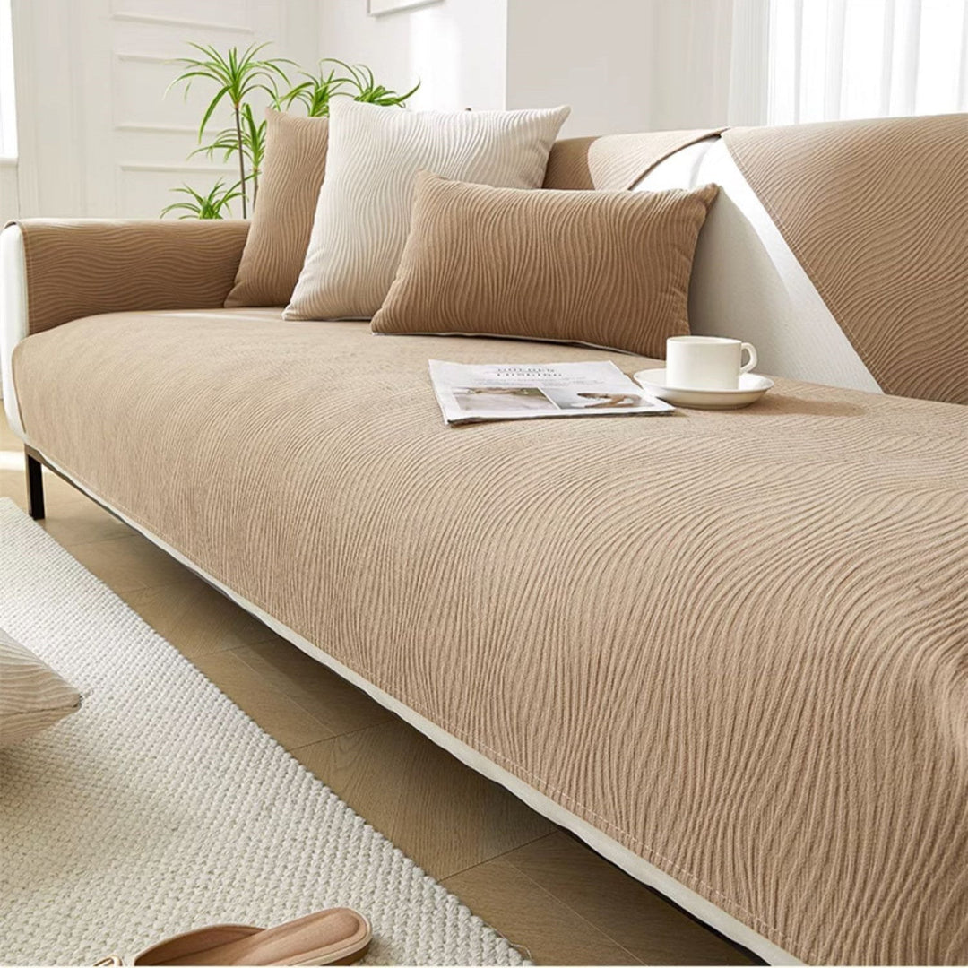 Khaki beige textured sofa cover styled elegantly on a modern couch
