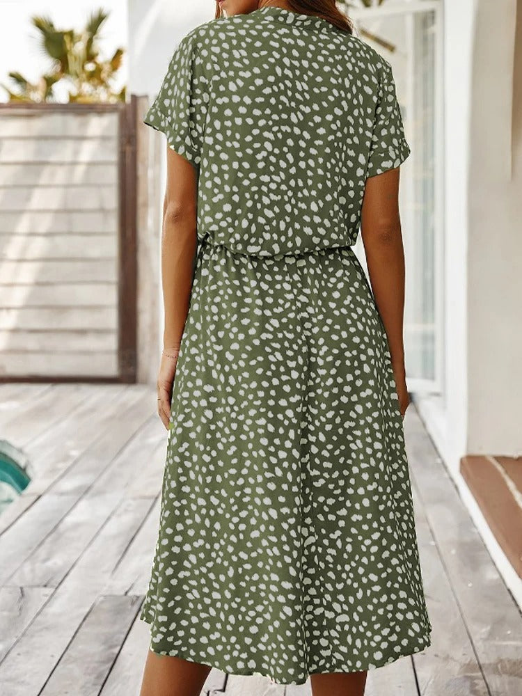 Side view of women's chic printed short-sleeve summer midi dress