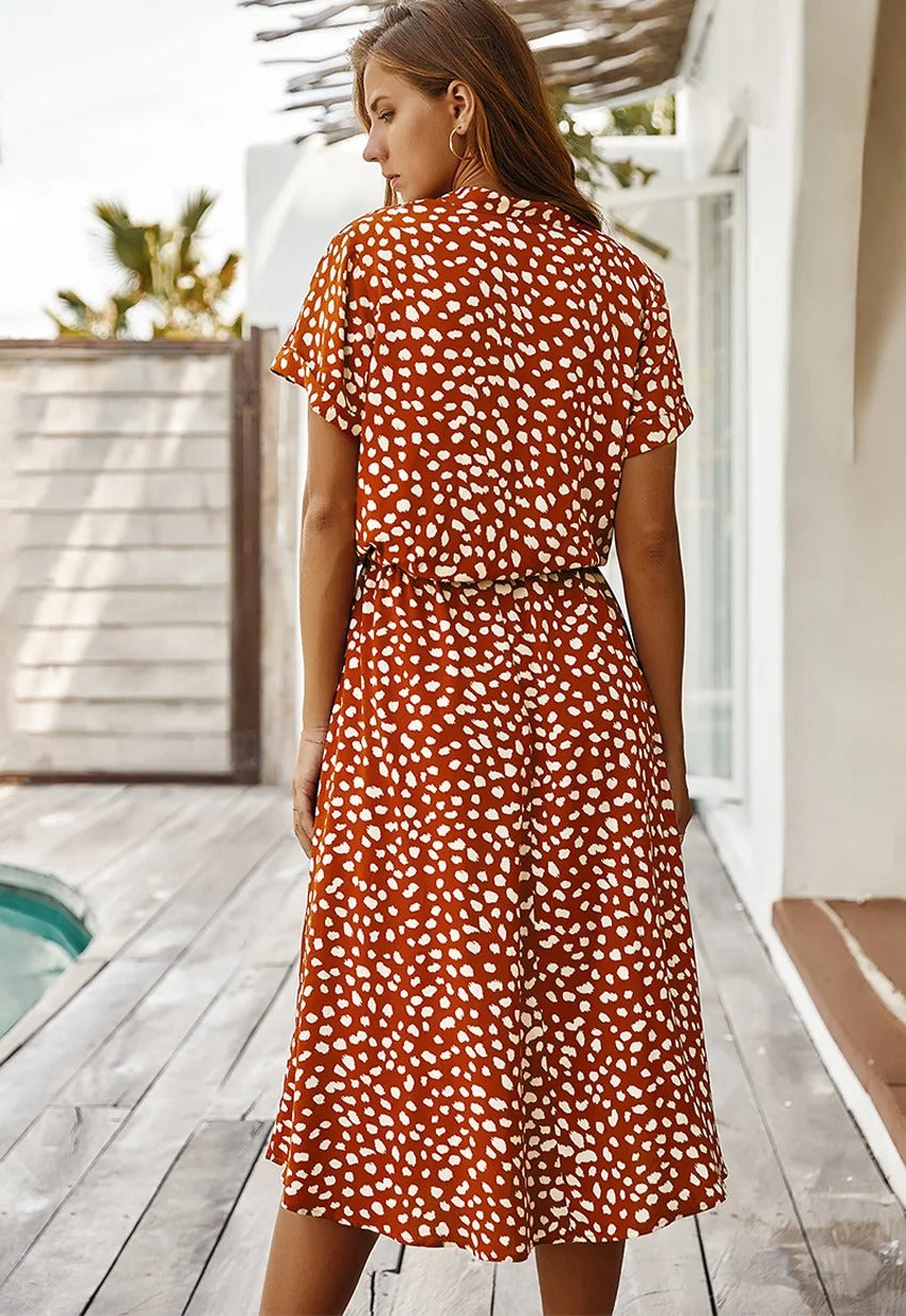 Close-up fabric pattern detail of the women's printed summer dress