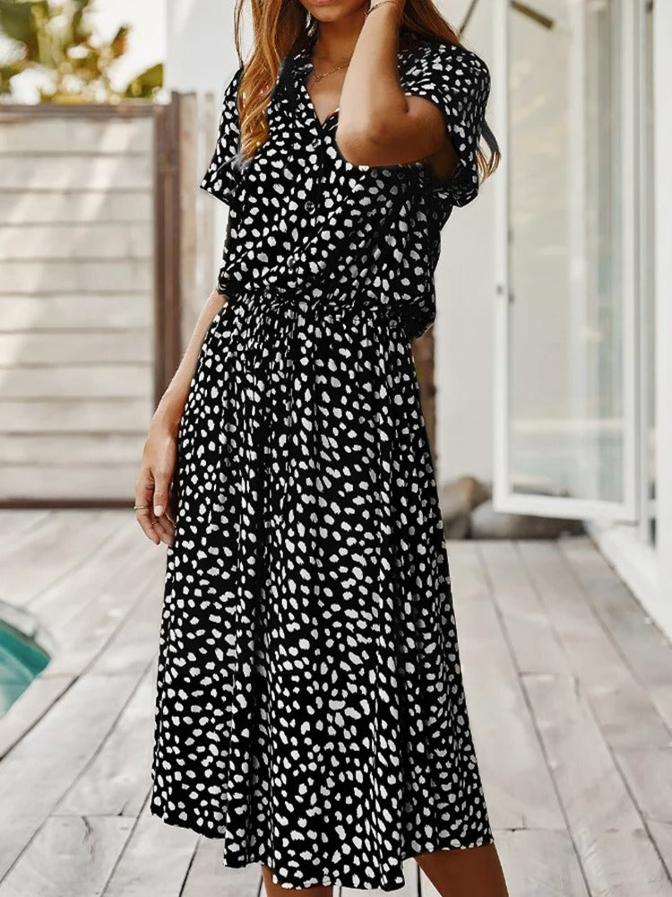 Full length view of woman styling the casual printed summer dress