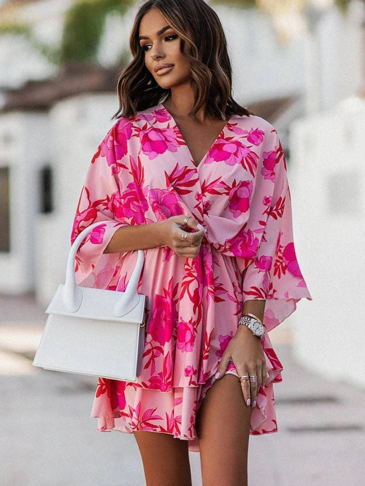 Back view of the chic floral mini dress showing the flattering womens fit