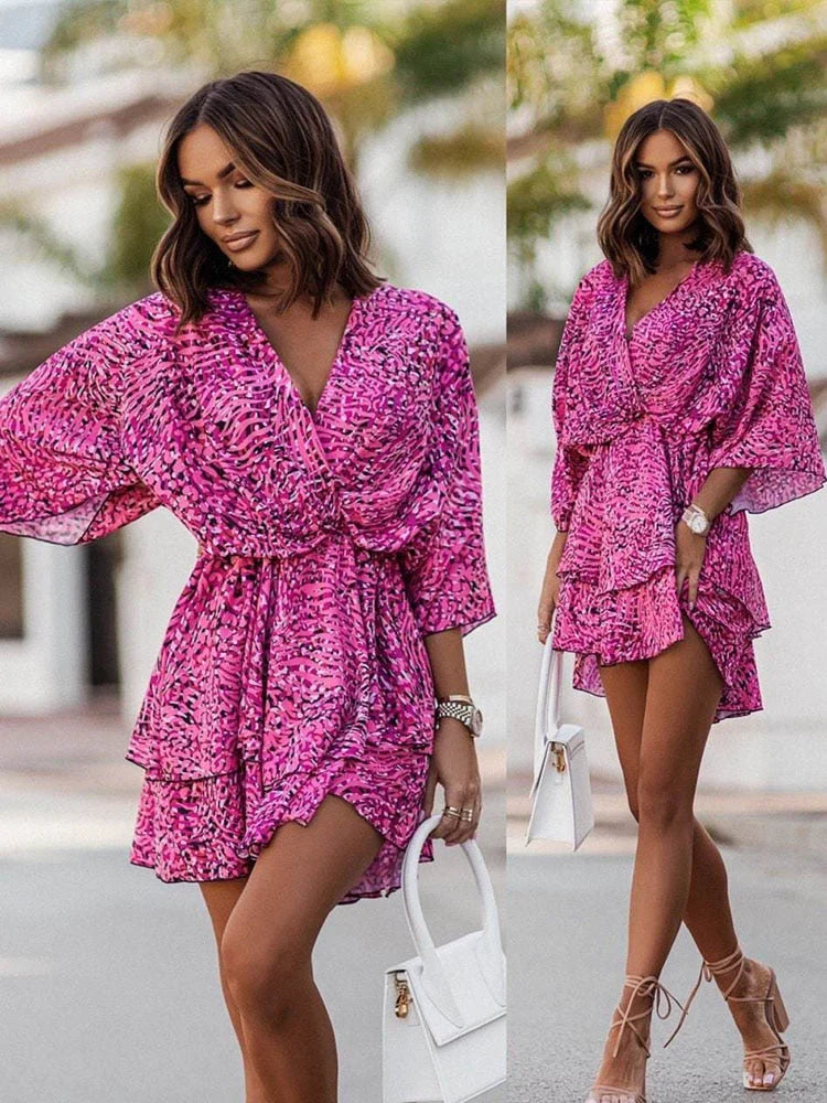 Stylized flat lay of the womens floral mini dress with casual accessories