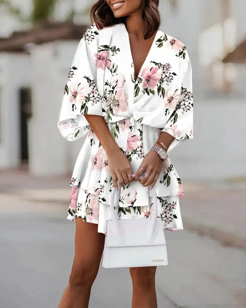 Close-up of the V-neck design on the elegant womens floral mini dress