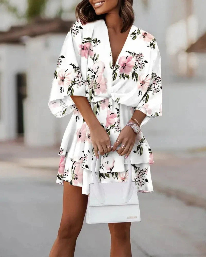 Close-up of the V-neck design on the elegant womens floral mini dress