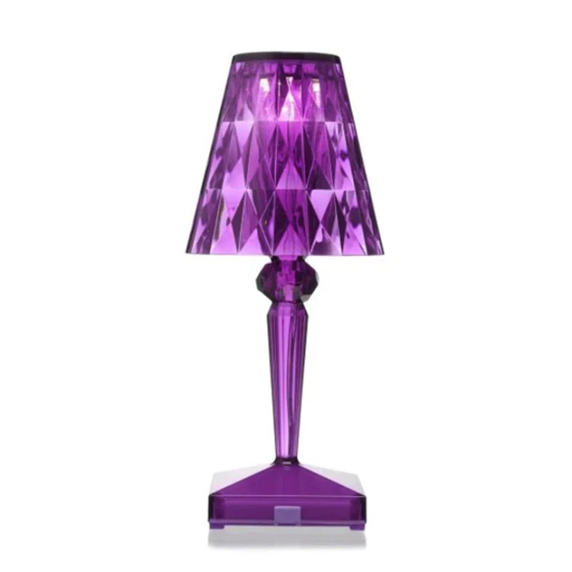 Vibrant purple crystal table lamp casting colorful ambient light