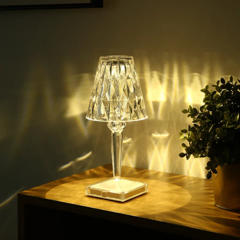 Ambient crystal bedside lamp glowing softly in a cozy room setting