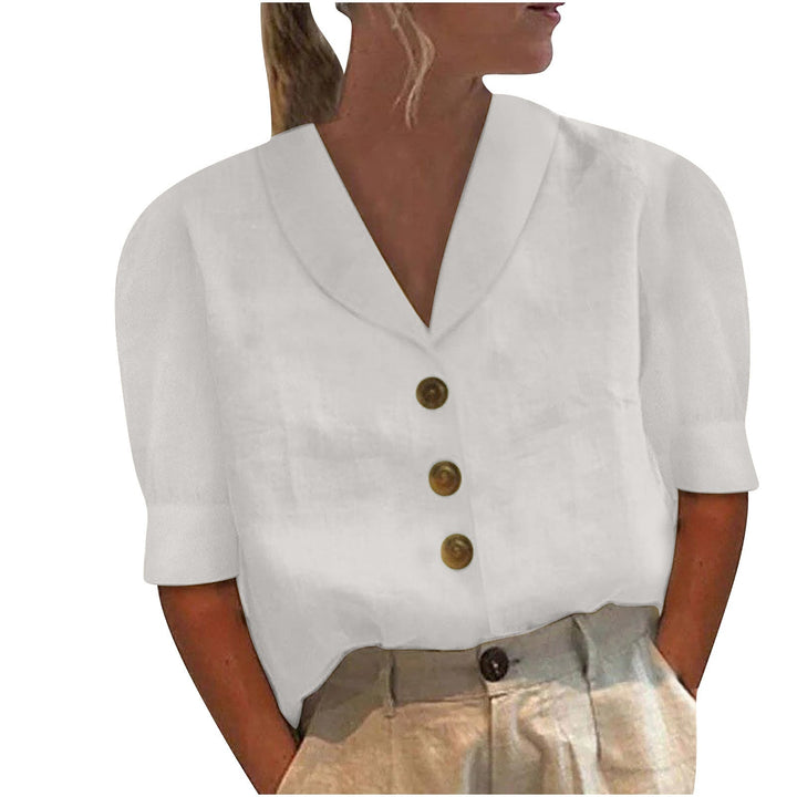 Close-up of a white women's blouse with V-neck and buttons