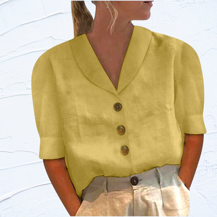 Close-up of button down details on women's chic blouse