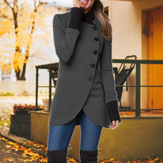 Woman wearing grey Sierra windbreaker with asymmetric buttons