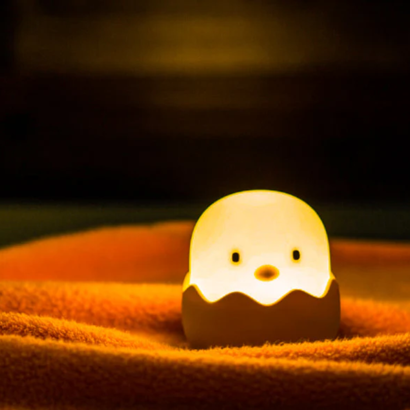Cute chick night light glowing softly in a child room
