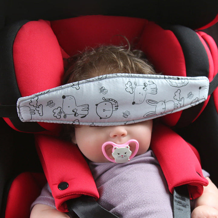 Child headrest for car seat in grey design supporting sleeping baby