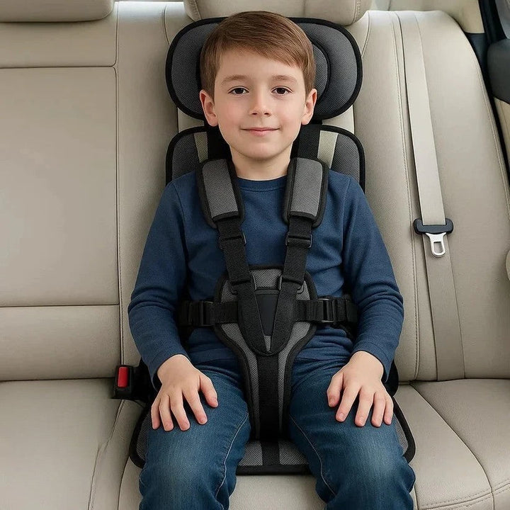 Parent securing a toddler into the five point harness car seat