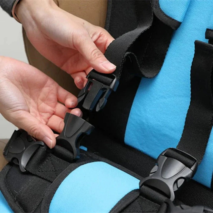 Close up of adjustable buckles on the portable car seat harness