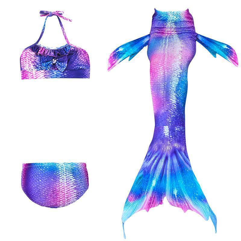 Happy kid wearing mermaid tail swimwear for summer vacation
