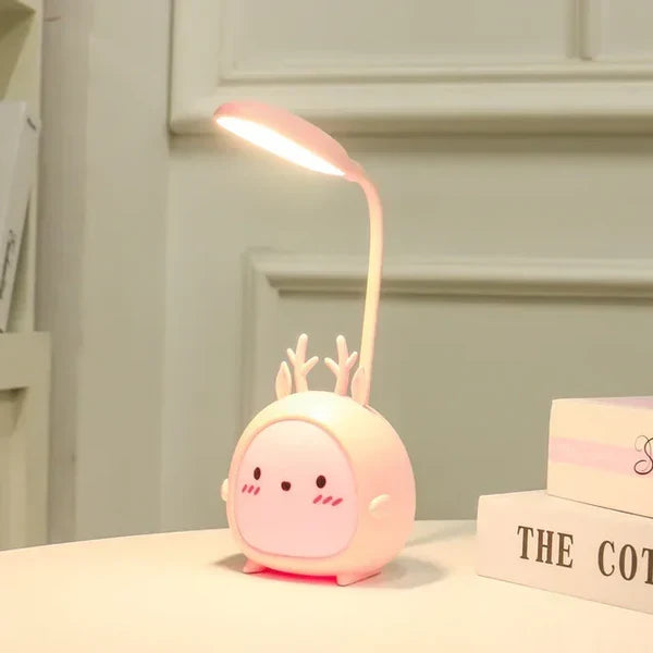 Pink deer kids desk lamp showing soft glowing night light feature