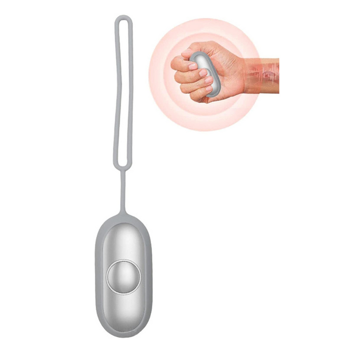 Close-up of a hand holding the grey portable pulse relaxation device