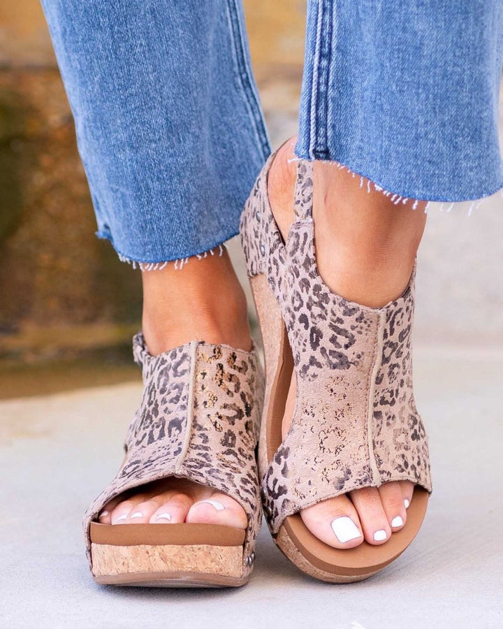 Side profile of women's chunky wedge platform sandals with open toe design