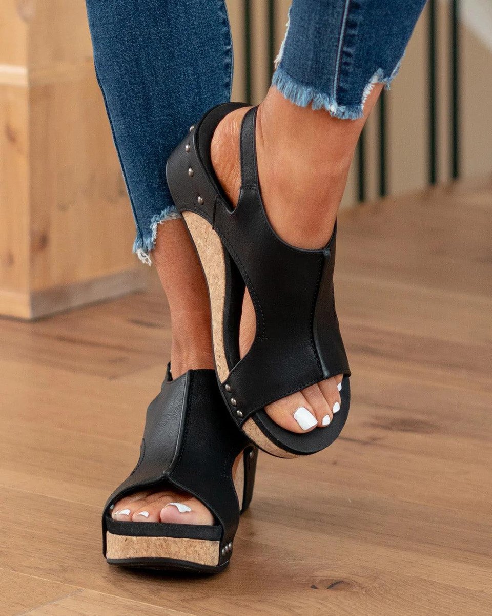 Angle shot of stylish women's wedge sandals paired with summer footwear style