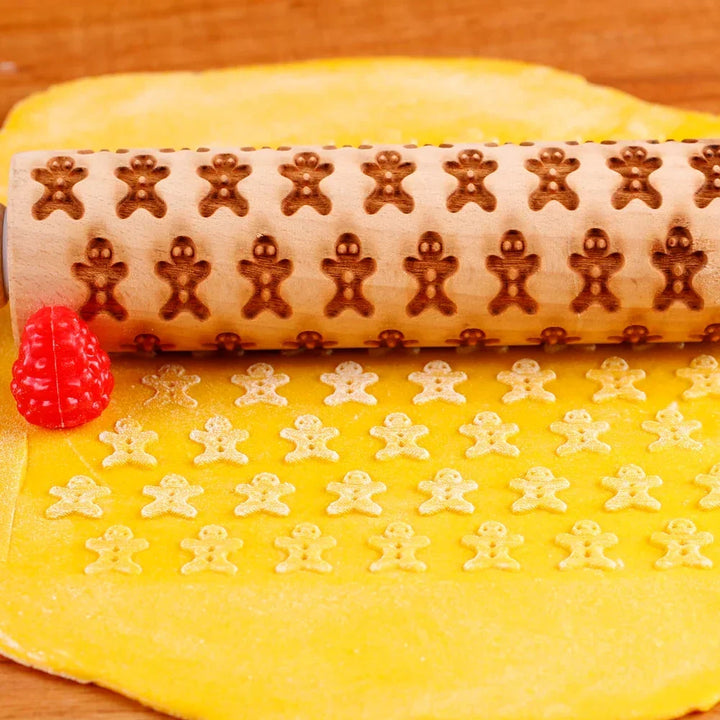 Gingerbread man pattern embossed clearly onto cookie dough with a rolling pin