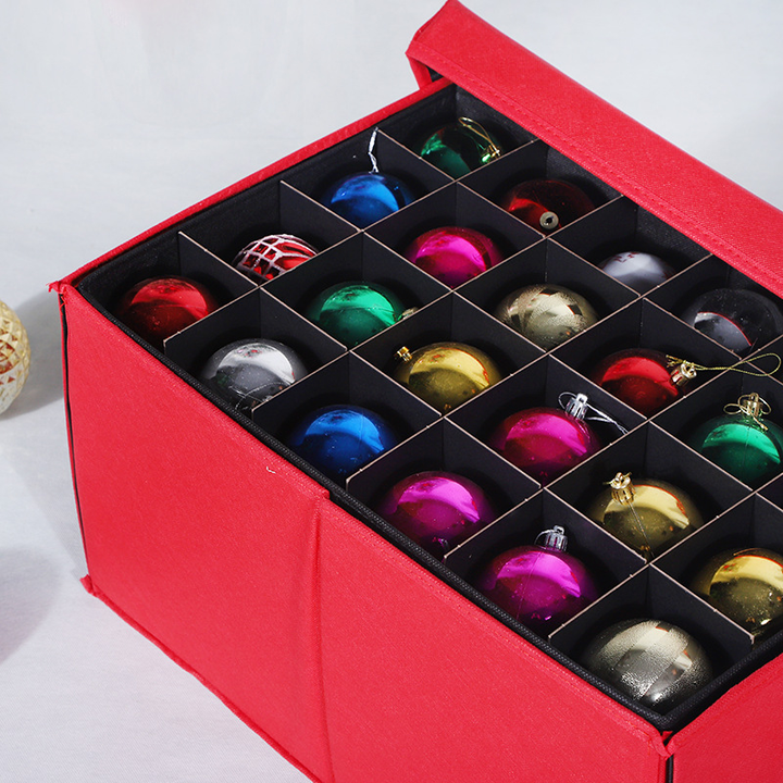 Close-up view of upper stackable tray filled with assorted holiday tree ornaments
