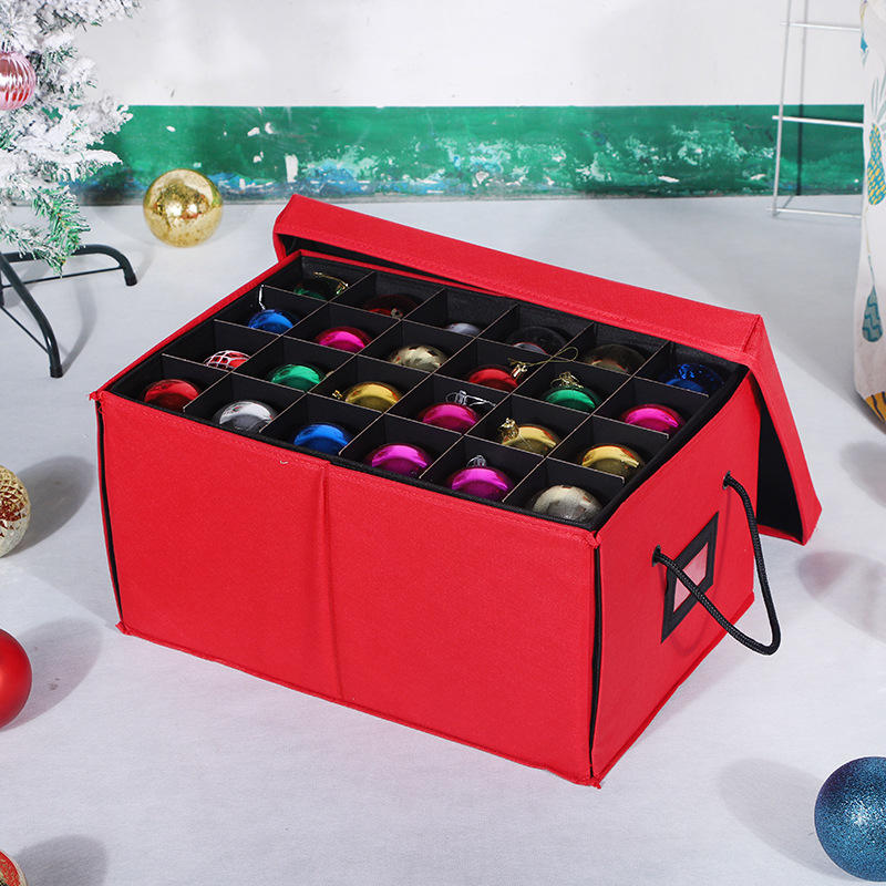 Red Christmas ornament storage box fully closed with side rope handles and label slot