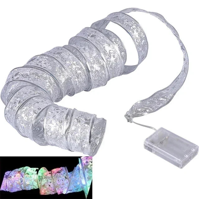 Silver Christmas ribbon LED fairy lights rolled in a coil with a battery pack