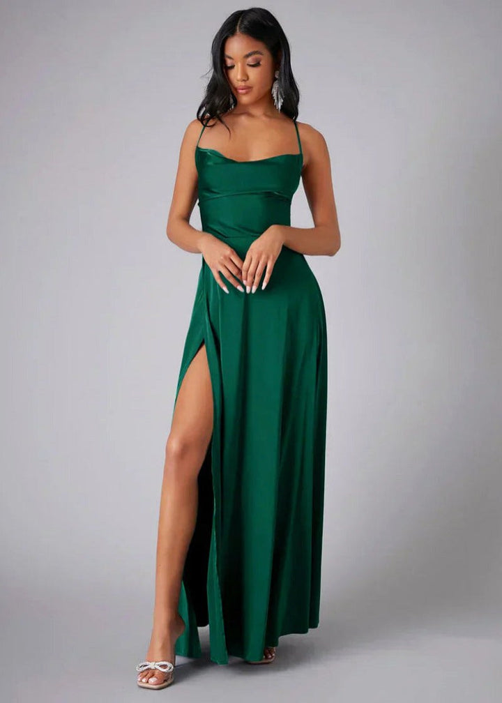 Model wearing green satin maxi gown with high slit
