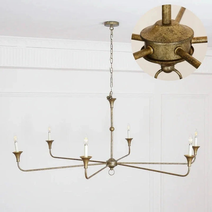 Gold leaf finish classic chandelier mounted on a ceiling with warm lighting
