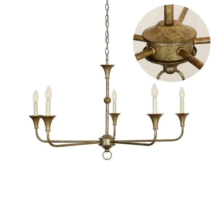 Adjustable drop height brass ceiling light glowing softly in a hallway