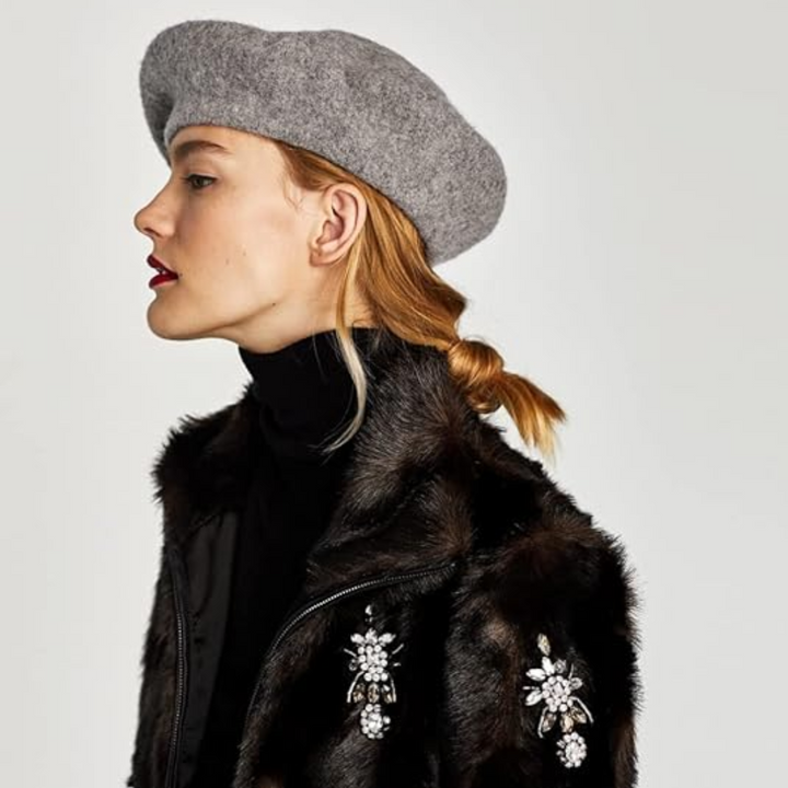 Fashion model wearing chic French beret accessory