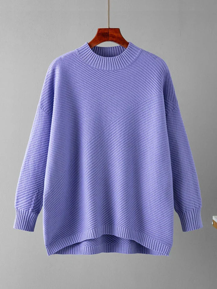 Close-up view of a fall fashion crew neck sweater showcasing soft ribbed knit texture.
