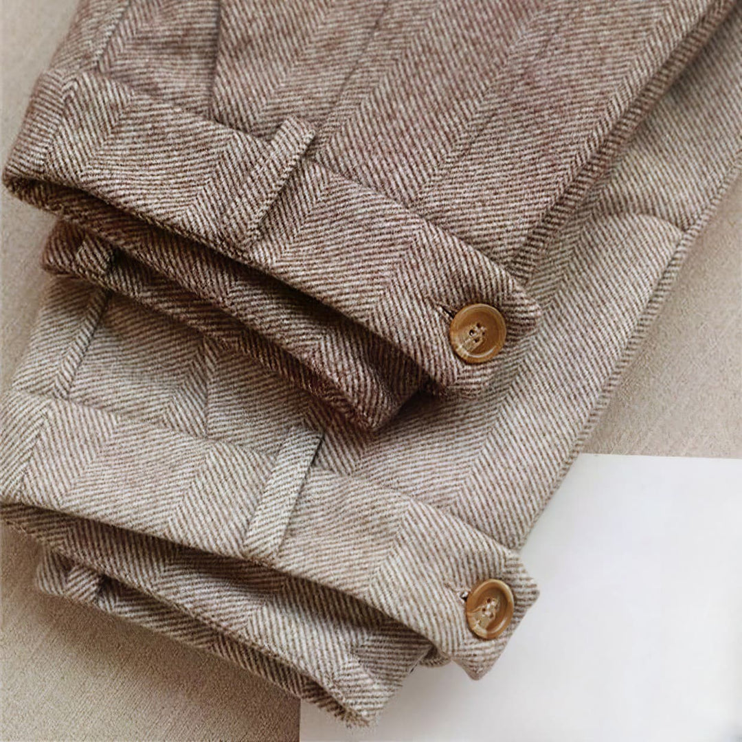 Close up view of premium herringbone fabric texture on formal dress trousers
