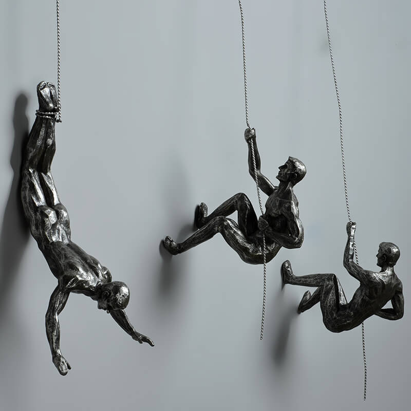 Modern wall art climber ornament mounted securely on a neutral background wall