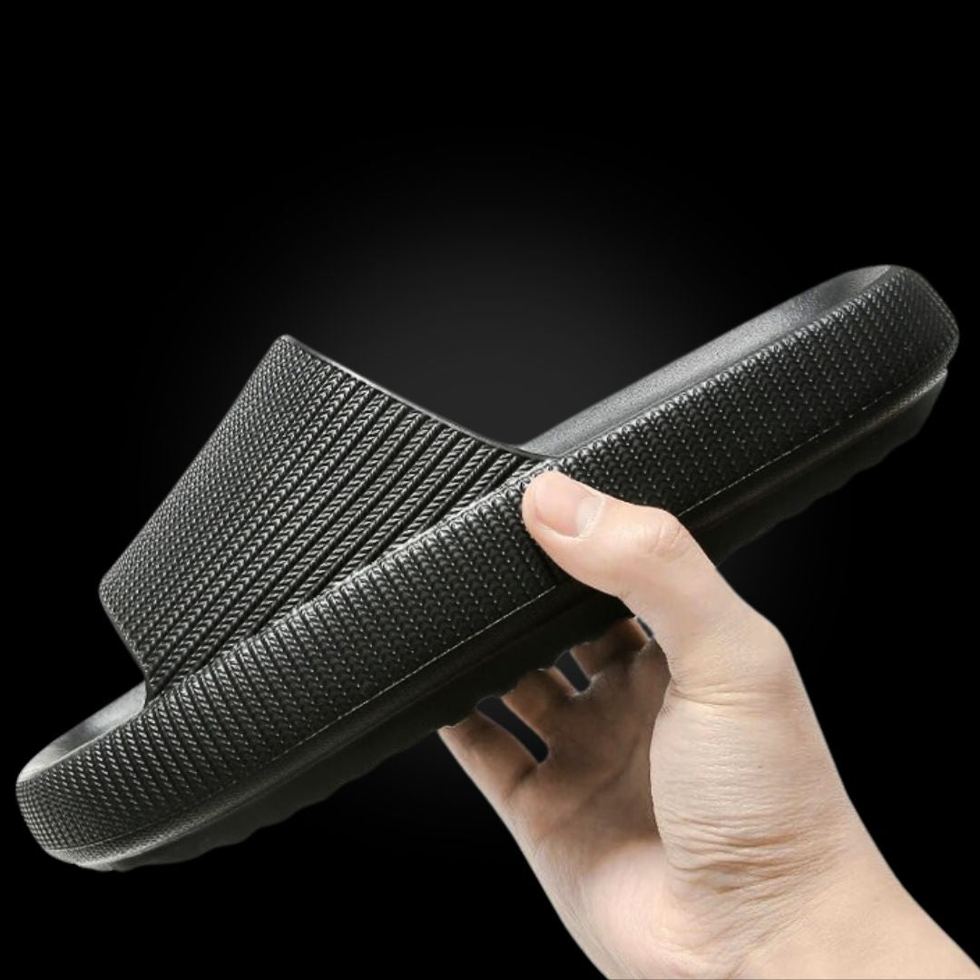 Foot pain relief sandals showing wide strap and supportive contour structure