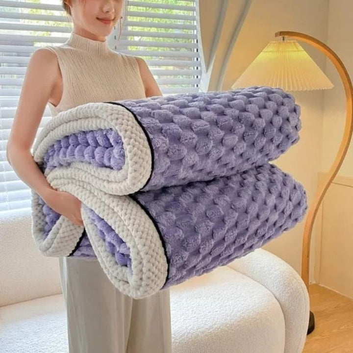Inviting sleep setup with a calming weighted blanket ready for bedtime
