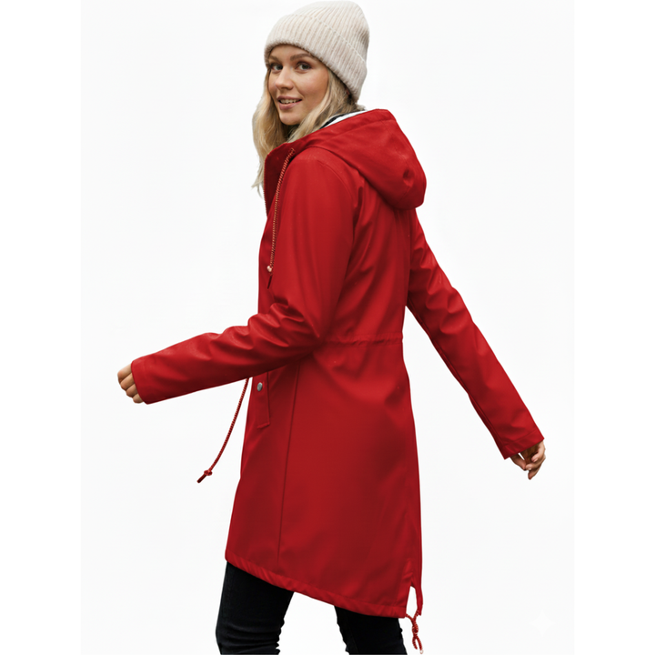 Folded women's waterproof rain jacket displaying its compact size and travel-friendly design.