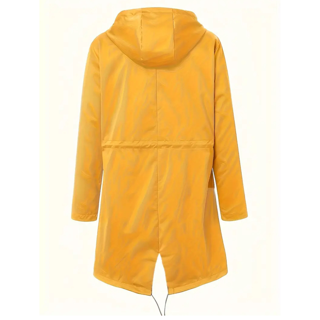Woman wearing a stylish waterproof rain jacket over casual clothing for everyday wear.