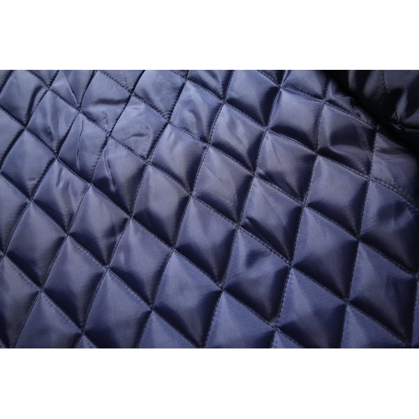 Detailed shot of stand collar jacket button and zipper closure features