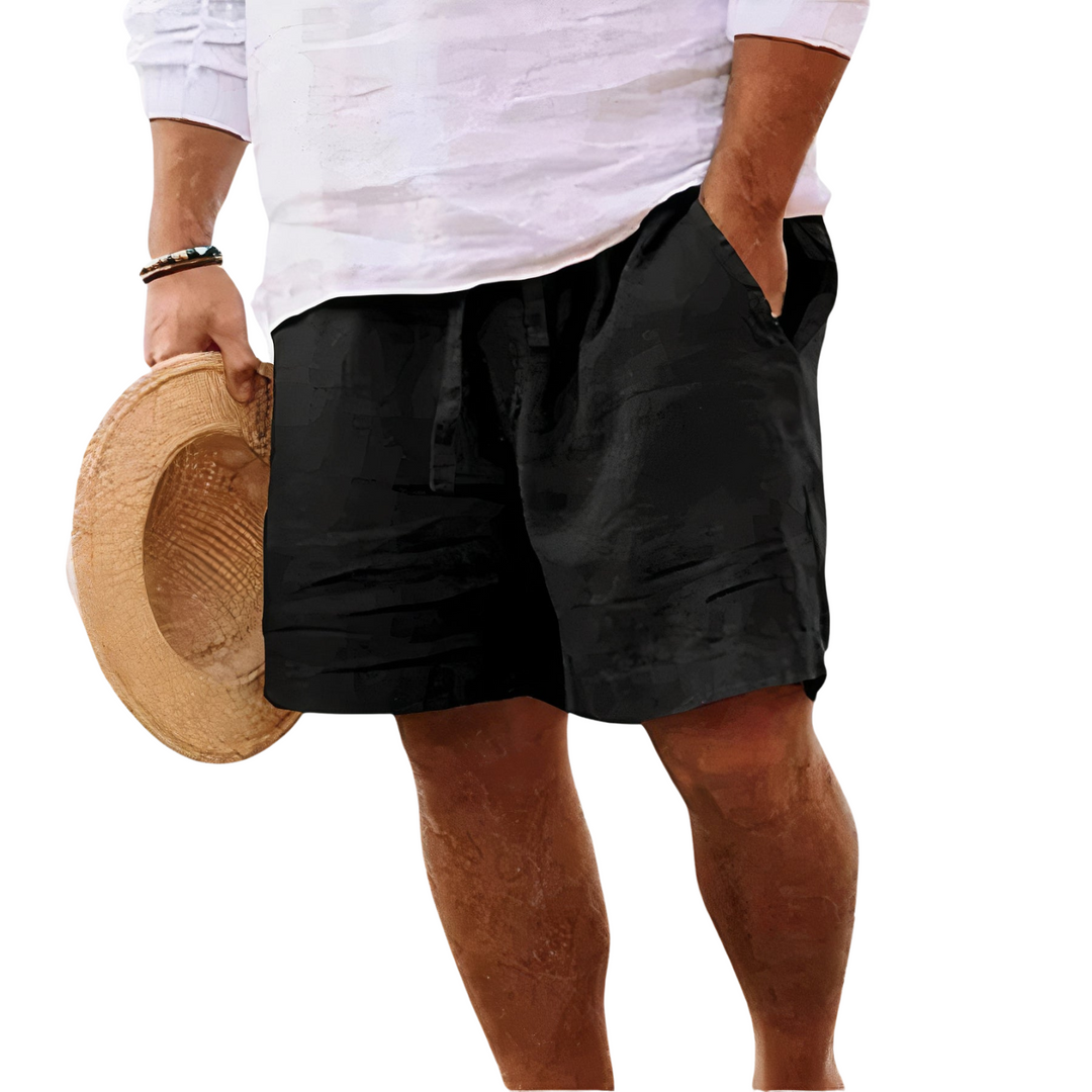 Close-up of man wearing black summer shorts with pockets and drawstring