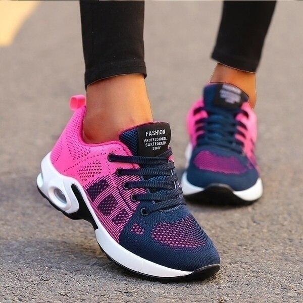 Pink and blue women's orthopedic sneaker viewed from the side