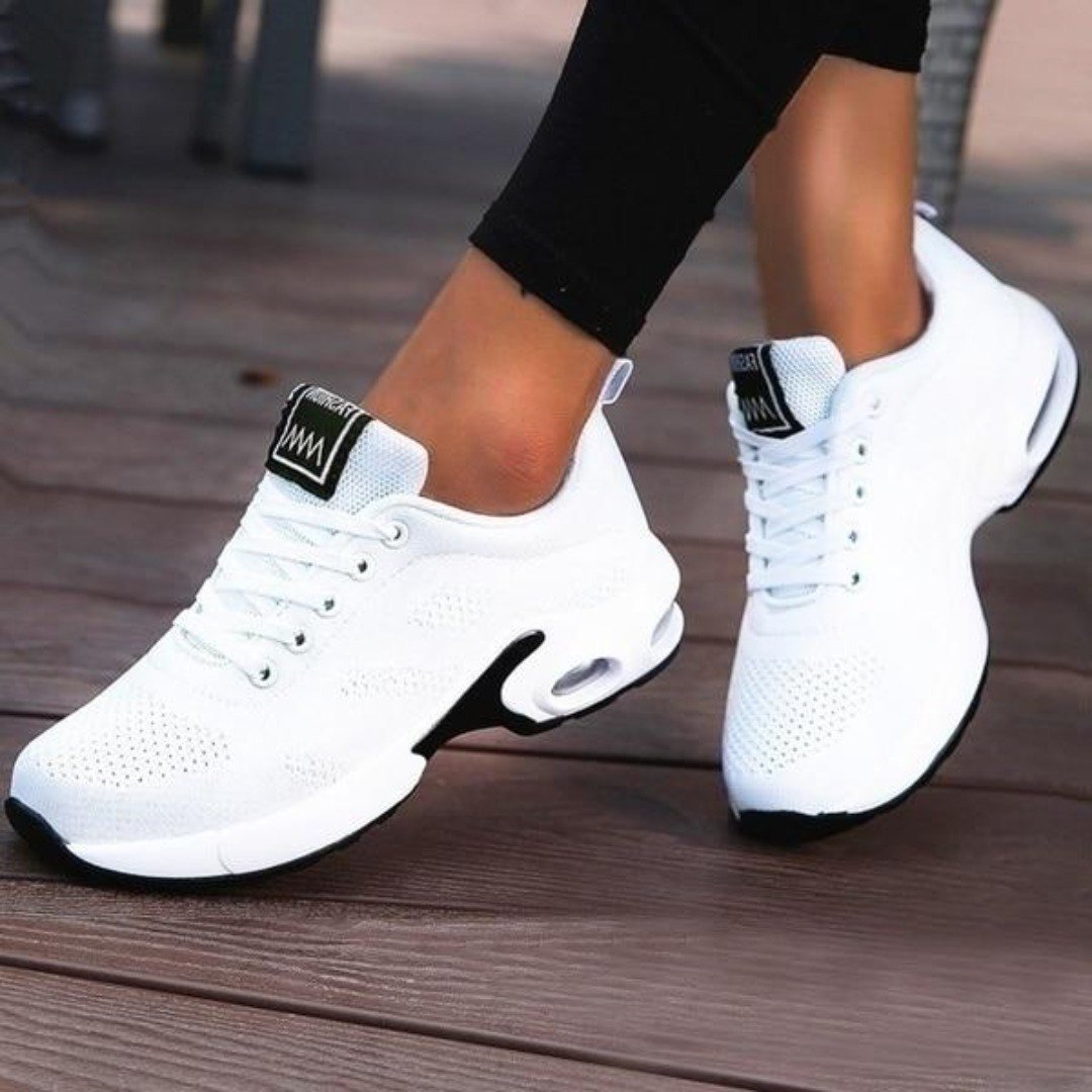 Side view of comfortable orthopedic sneakers with shock-absorbing gel sole for women